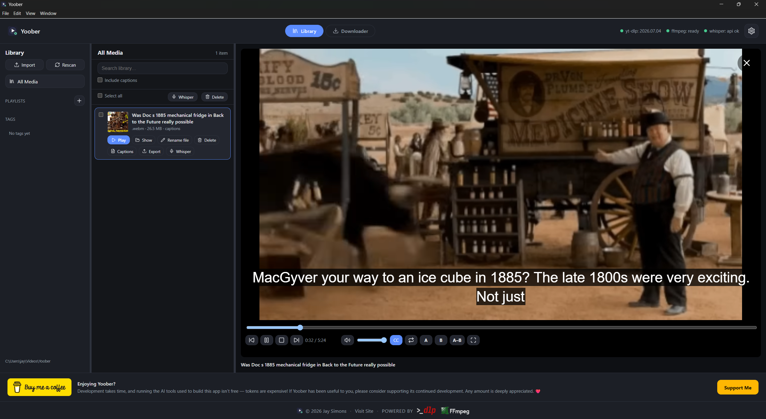 Yoober desktop app on Windows showing the Library view with a video playing in the in-app player, closed captions visible, and caption tools for Whisper and export
